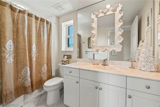 full bathroom featuring vanity, shower / tub combo with curtain, tile patterned floors, and toilet