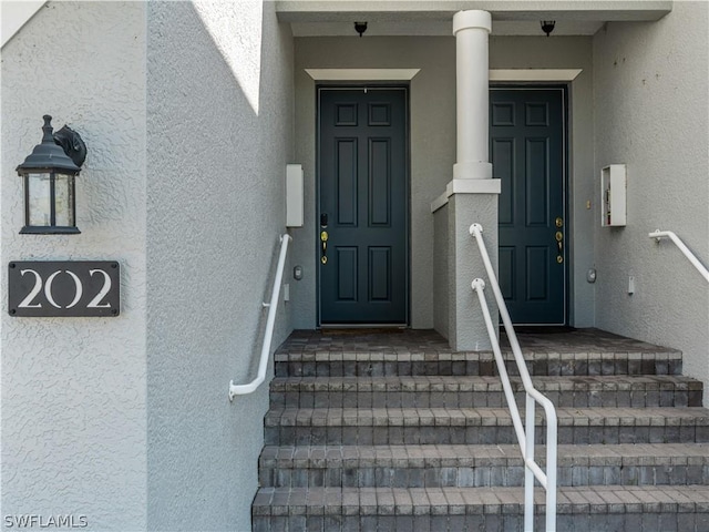 16521 Goldenrod Ln Unit 202, Alva, FL 33920 - doorway to property featuring stucco siding