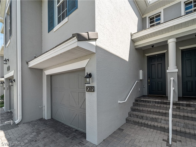 property entrance with a garage