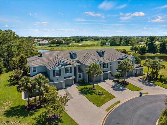16521 Goldenrod Ln Unit 202, Alva, FL 33920 - view of subject property with a large body of water and a tree filled landscape