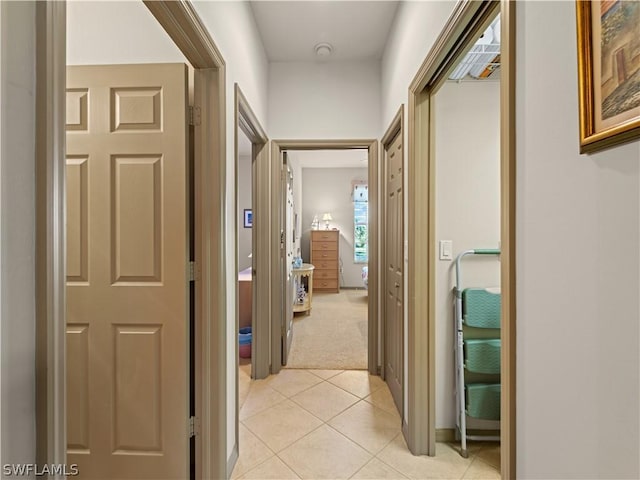 16521 Goldenrod Ln Unit 202, Alva, FL 33920 - hallway featuring light tile patterned floors and light carpet