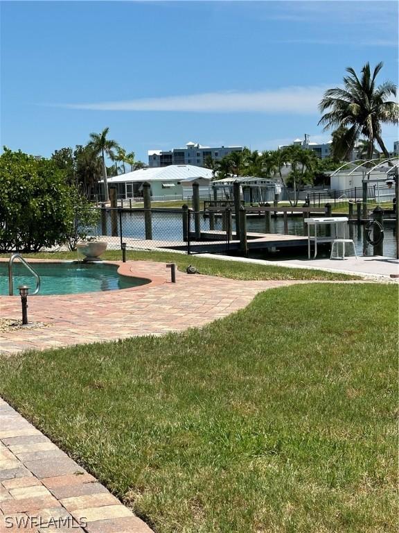dock area featuring a lawn