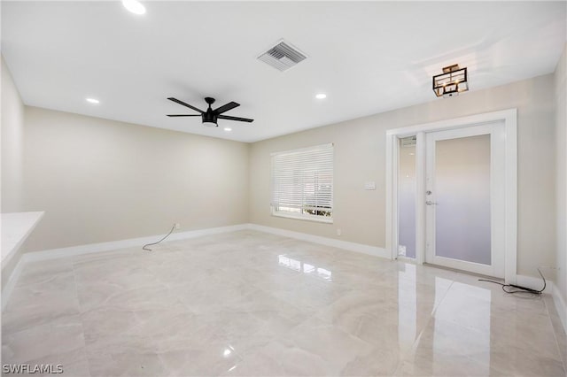 empty room featuring visible vents, baseboards, marble finish floor, recessed lighting, and a ceiling fan