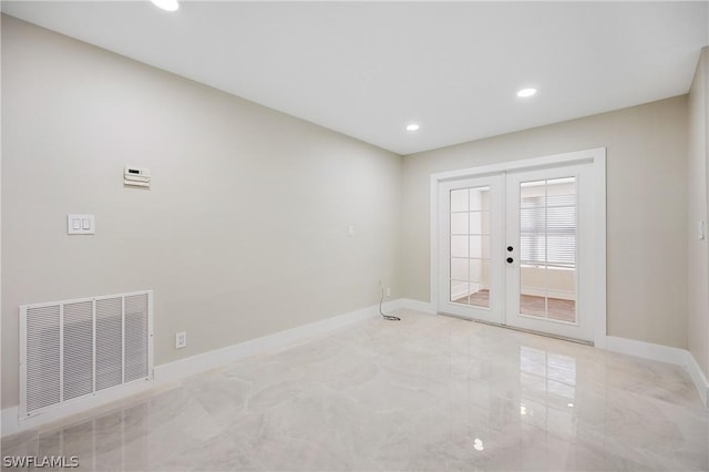 unfurnished room with baseboards, visible vents, recessed lighting, and french doors