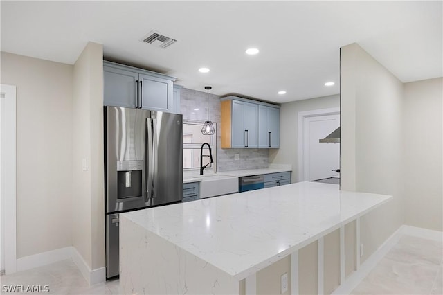 kitchen with a sink, dishwasher, stainless steel refrigerator with ice dispenser, visible vents, and decorative backsplash