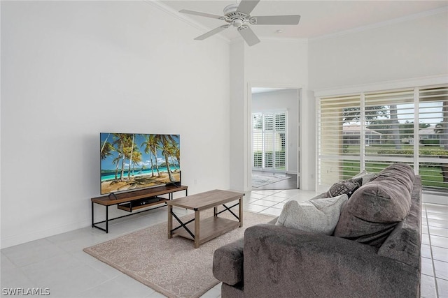 living room featuring light tile patterned floors, ceiling fan, and ornamental molding