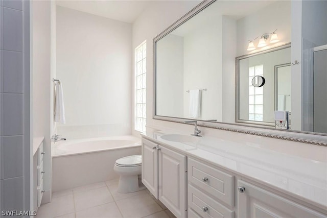 full bathroom featuring tile patterned flooring, vanity, toilet, and a healthy amount of sunlight