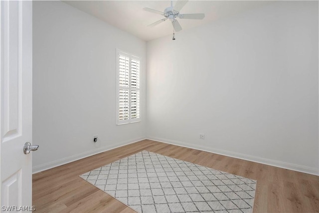 empty room featuring light wood-type flooring and ceiling fan