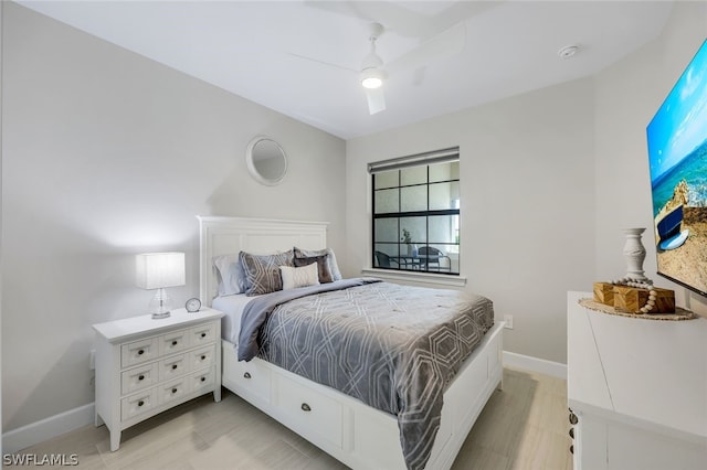 bedroom featuring ceiling fan and light wood-type flooring