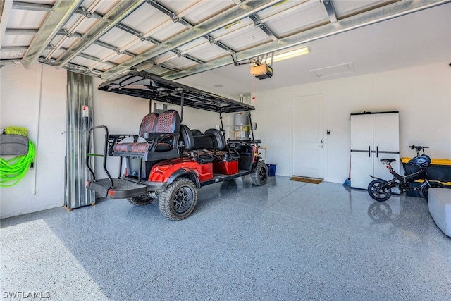 garage featuring a garage door opener