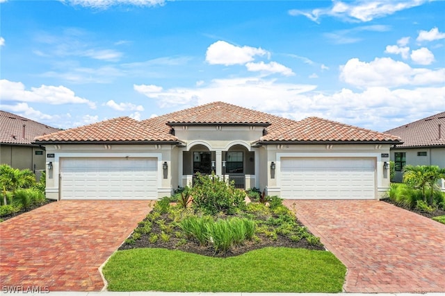 mediterranean / spanish-style home with a garage