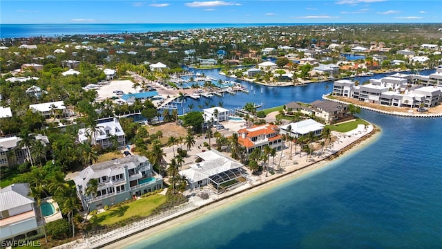 birds eye view of property featuring a view of the beach and a water view