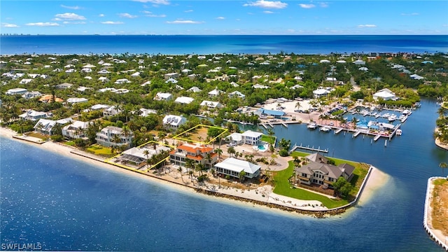 bird's eye view with a view of the beach and a water view