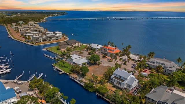 aerial view at dusk with a water view