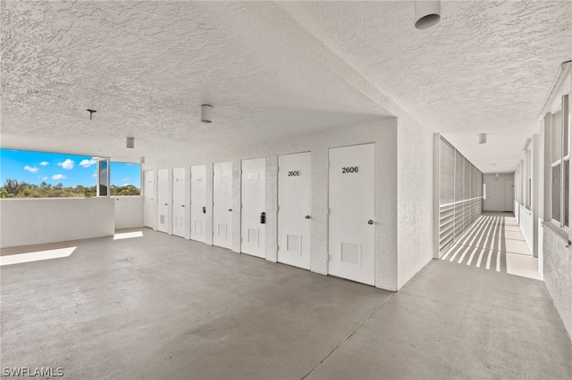 hallway with concrete flooring