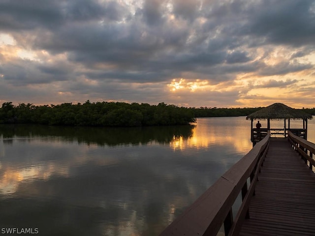 dock area with a gazebo and a water view