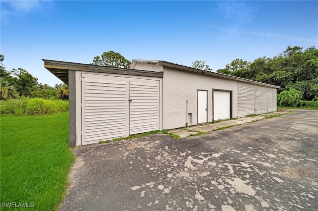 garage with a lawn