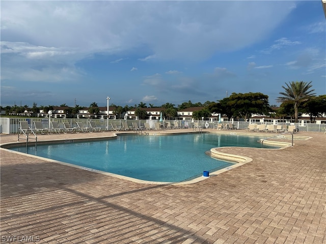 view of swimming pool with a patio