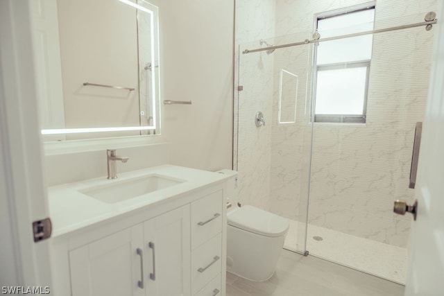 bathroom with tile floors, walk in shower, toilet, and vanity