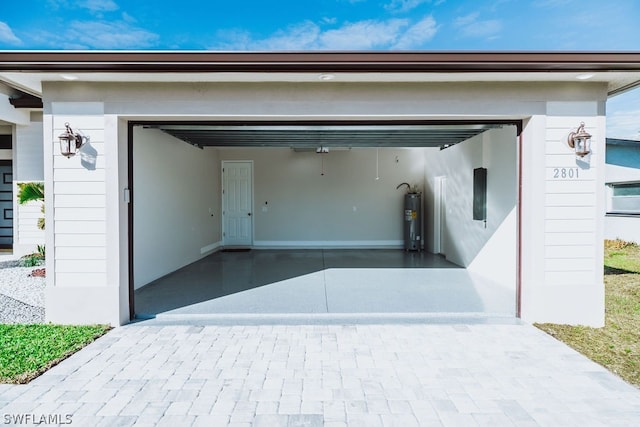 garage with water heater and a carport