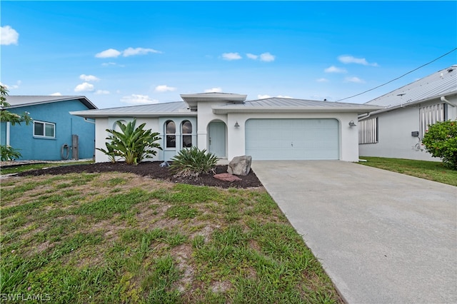 ranch-style house with a garage and a front yard