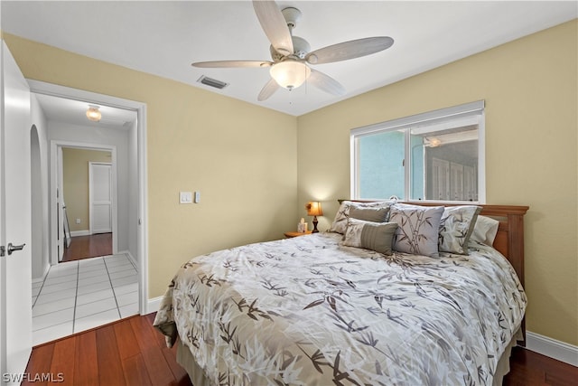 bedroom with ceiling fan and hardwood / wood-style floors