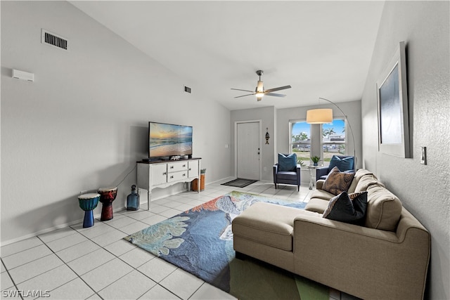 tiled living room with vaulted ceiling and ceiling fan