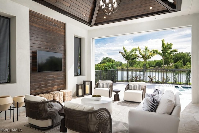 view of patio / terrace with an outdoor living space and a water view