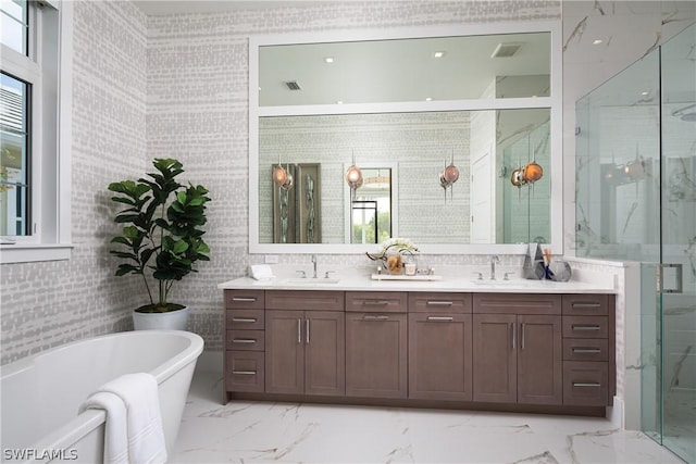 bathroom featuring separate shower and tub, plenty of natural light, and vanity