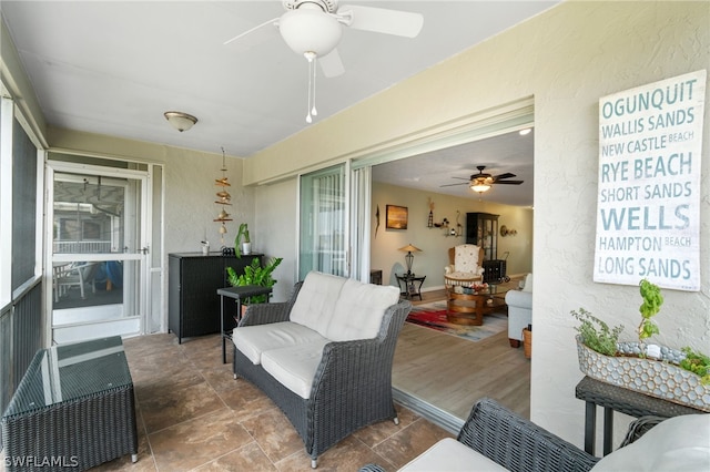 sunroom / solarium with ceiling fan