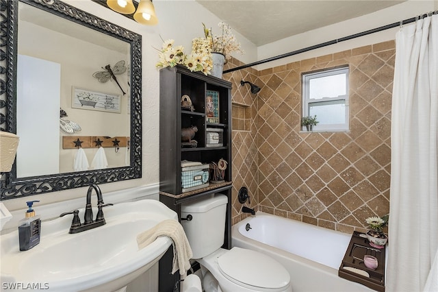 full bathroom featuring toilet, sink, and shower / tub combo