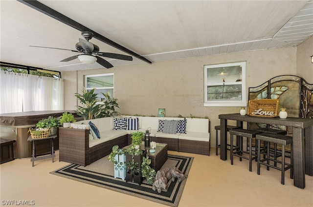 view of patio with an outdoor living space, ceiling fan, and a hot tub