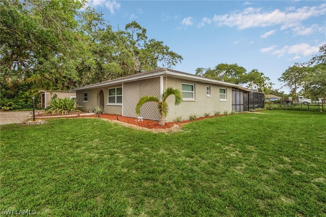 view of side of property featuring a lawn