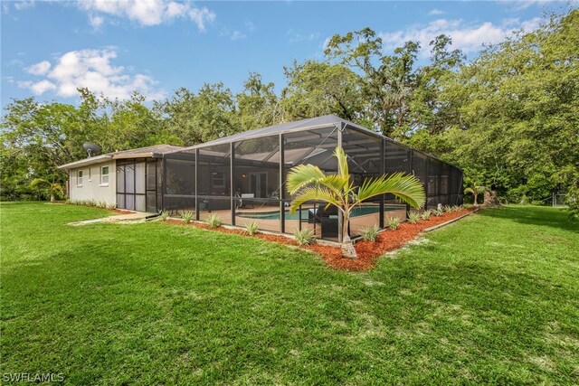 view of yard featuring glass enclosure