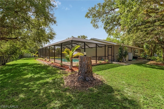 view of yard with a lanai