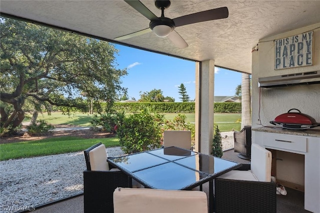 sunroom / solarium with ceiling fan