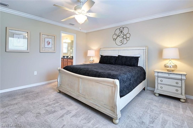 bedroom with ceiling fan, light colored carpet, crown molding, and connected bathroom