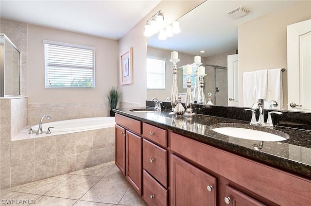 bathroom featuring tile patterned flooring, vanity, and independent shower and bath