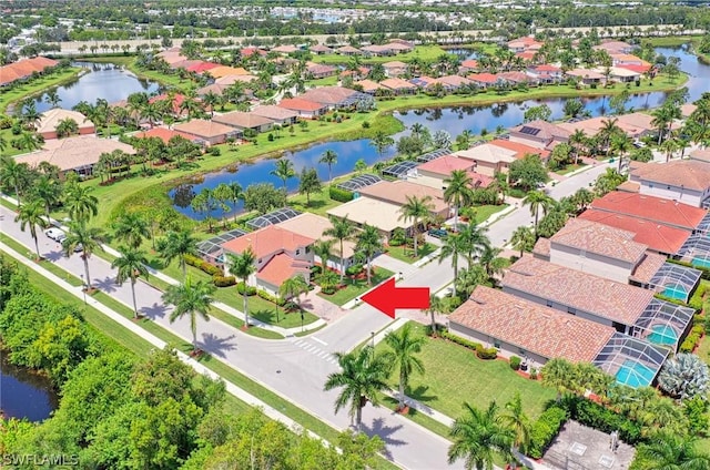 birds eye view of property featuring a water view