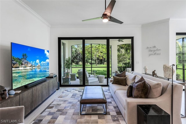 living room featuring ceiling fan and ornamental molding