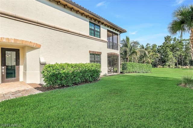 view of property exterior featuring a lawn