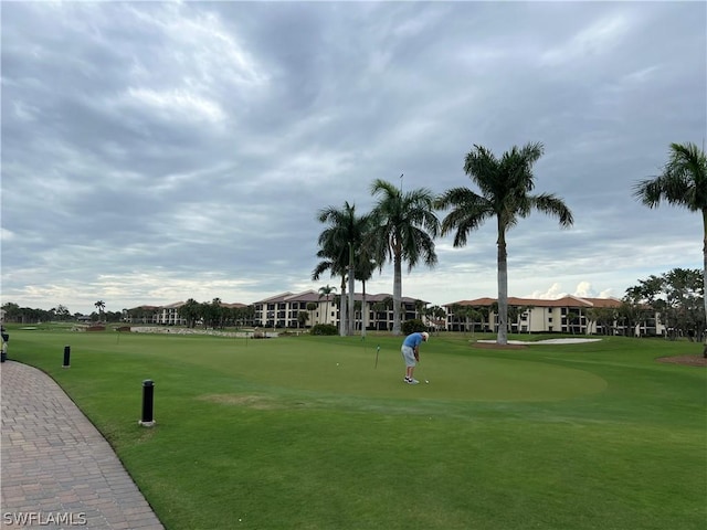 view of home's community featuring a lawn