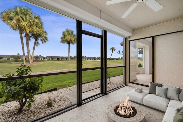 sunroom with ceiling fan and a healthy amount of sunlight