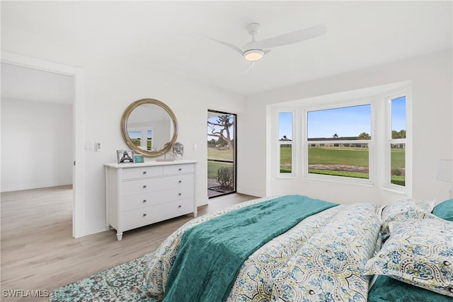 bedroom with ceiling fan and light hardwood / wood-style flooring