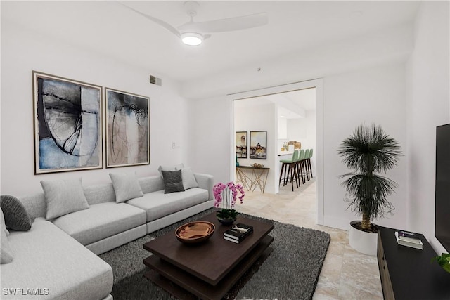 living room featuring ceiling fan