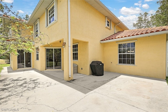 back of house featuring a patio area