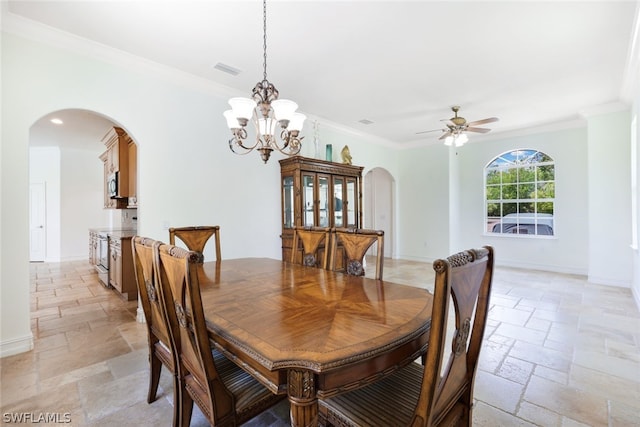 dining space with ceiling fan with notable chandelier and crown molding