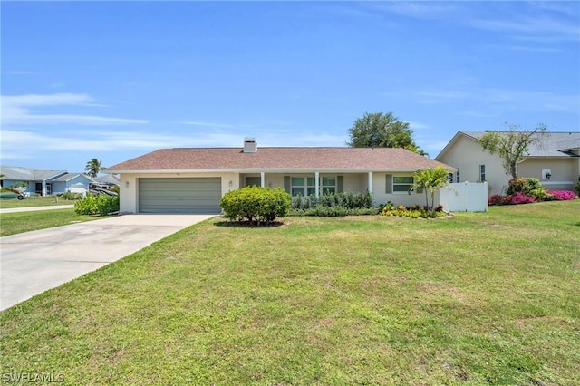 single story home featuring a garage and a front lawn