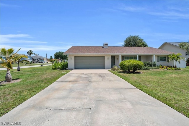 ranch-style home with a garage, a front lawn, and concrete driveway