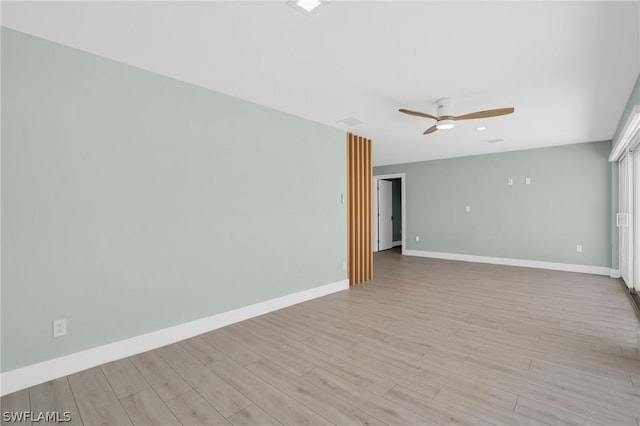 empty room featuring light hardwood / wood-style floors and ceiling fan